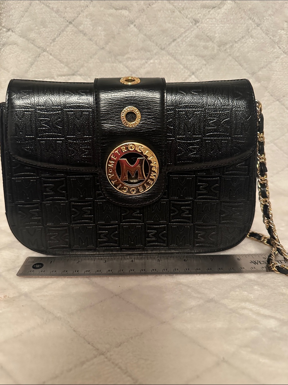 Metro Embossed Black Crossbody with Gold Medallion